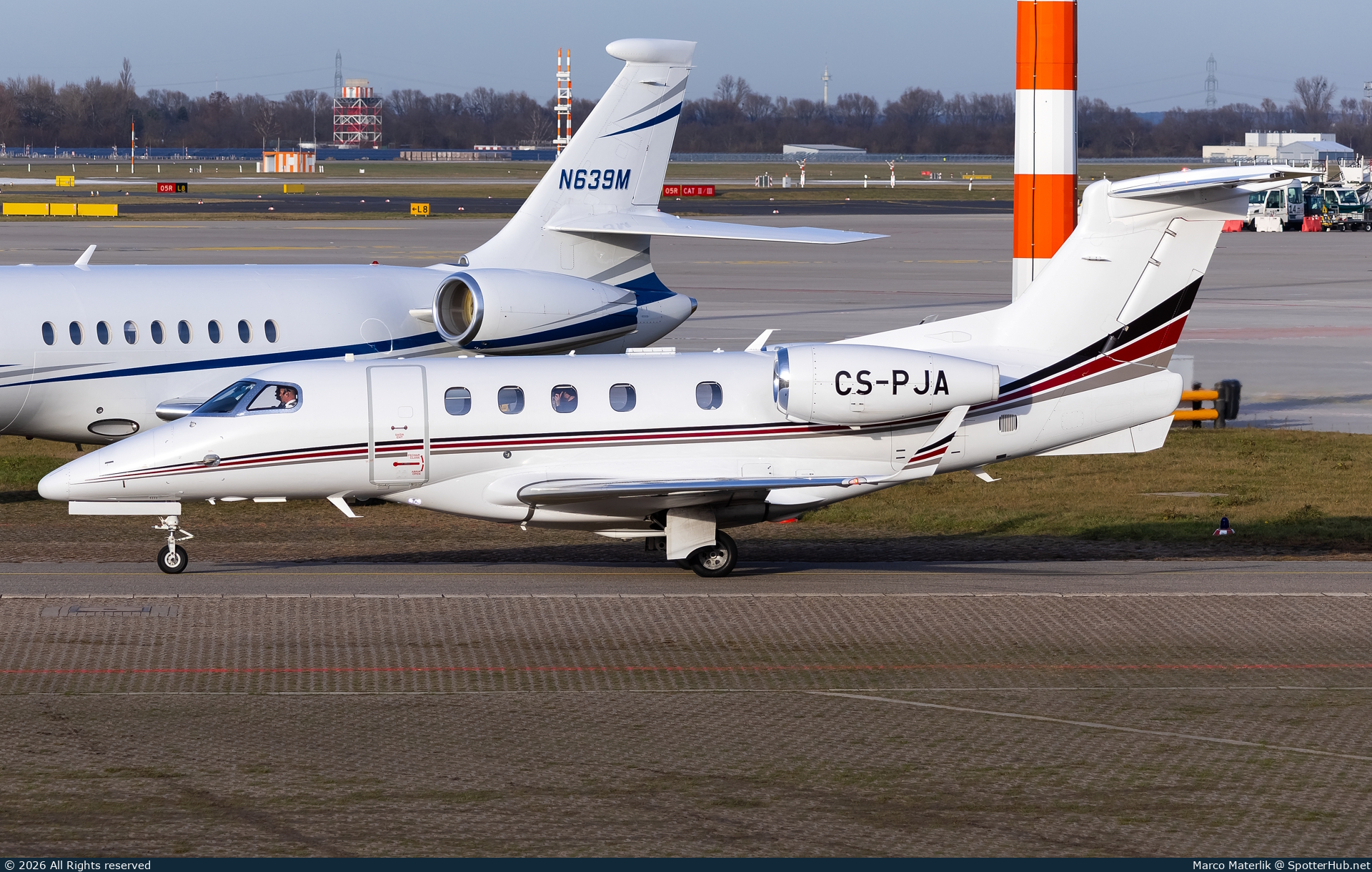 Photo of CS-PJA - Embraer Phenom 300 operated by NetJets Europe
