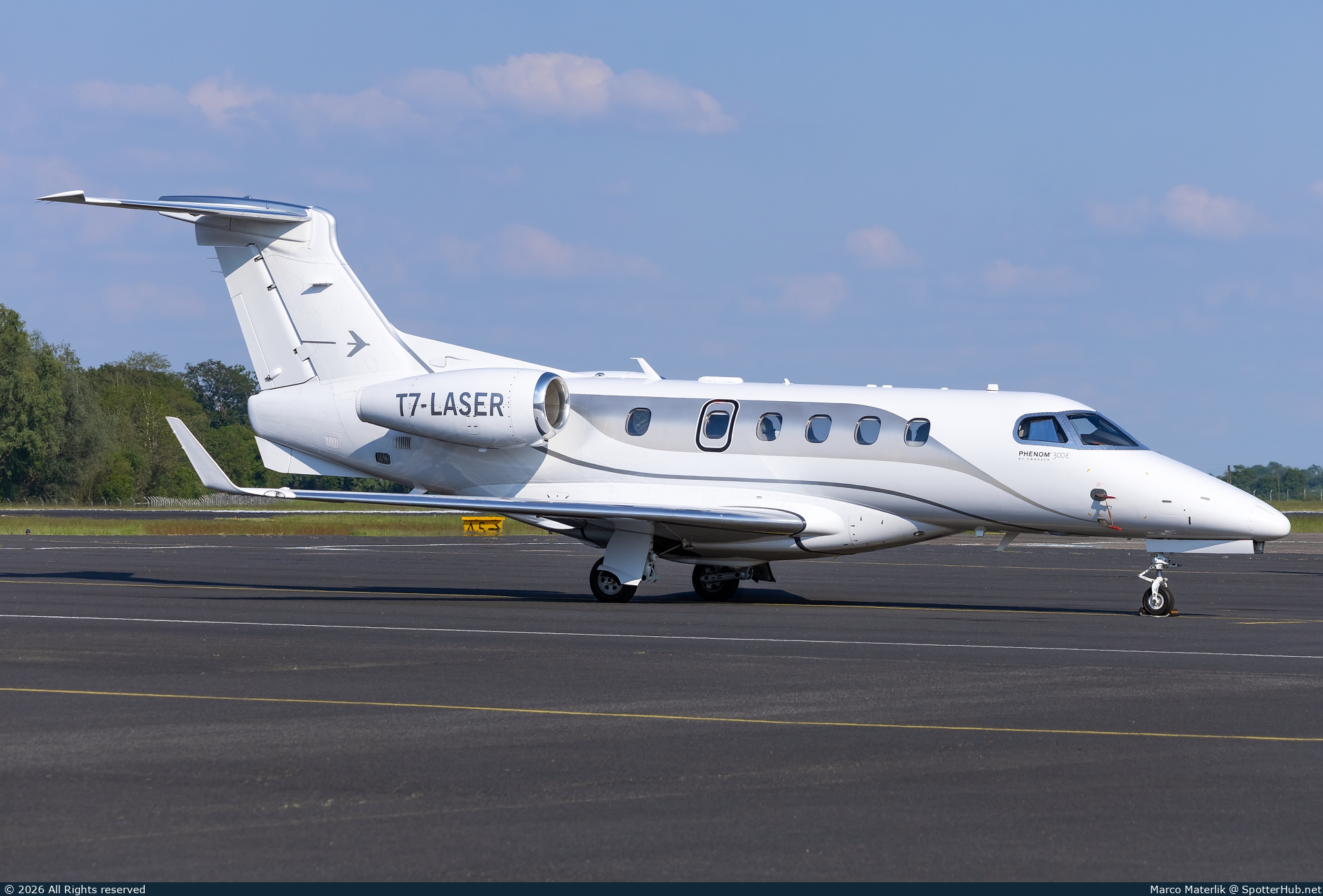 Photo of T7-LASER - Embraer Phenom 300E operated by Private