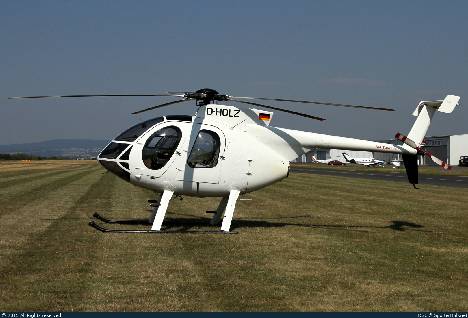 Photo of D-HOLZ - Hughes 369E operated by DHD Heliservice